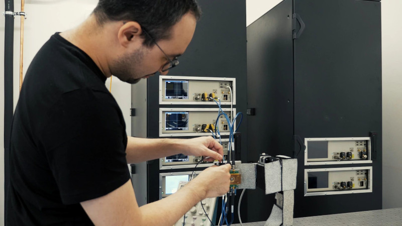 Male lab technician calibrating bench instruments