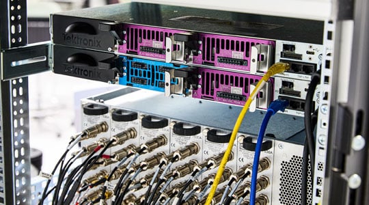 two MP5000 mainframes racked in a system showing rear with two dust covers four modules inserted and LAN connections