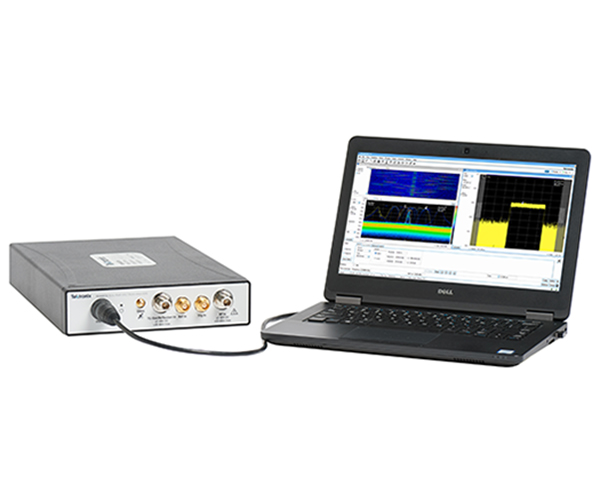 RSA607A Spectrum Analyzer plugged into a tablet PC running SignalVu-PC and displaying a DPX density trigger