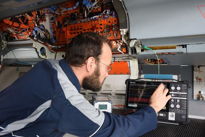 Engineer configuring a 2 Series MSO for an airbus